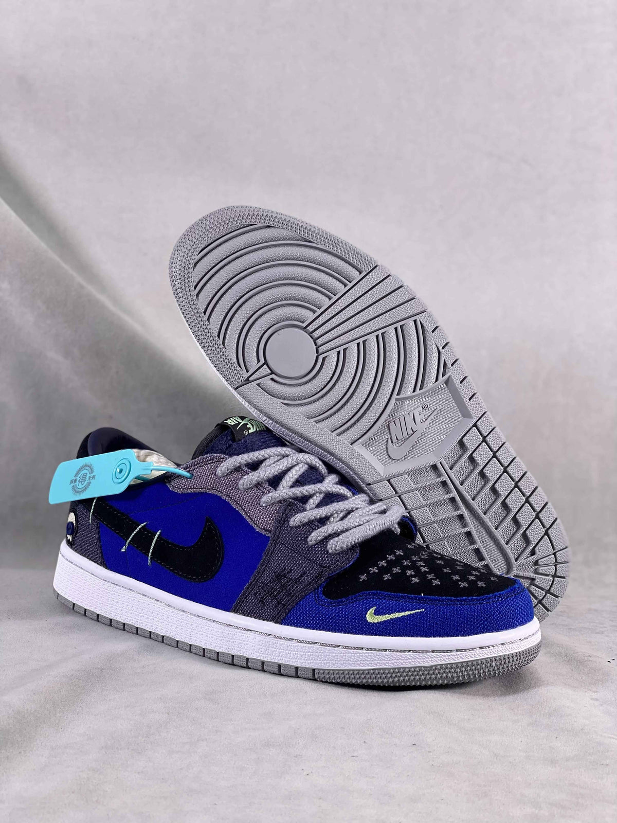 Luxury urban wear premium blue and black low-top Nike sneakers with unique sole and tag